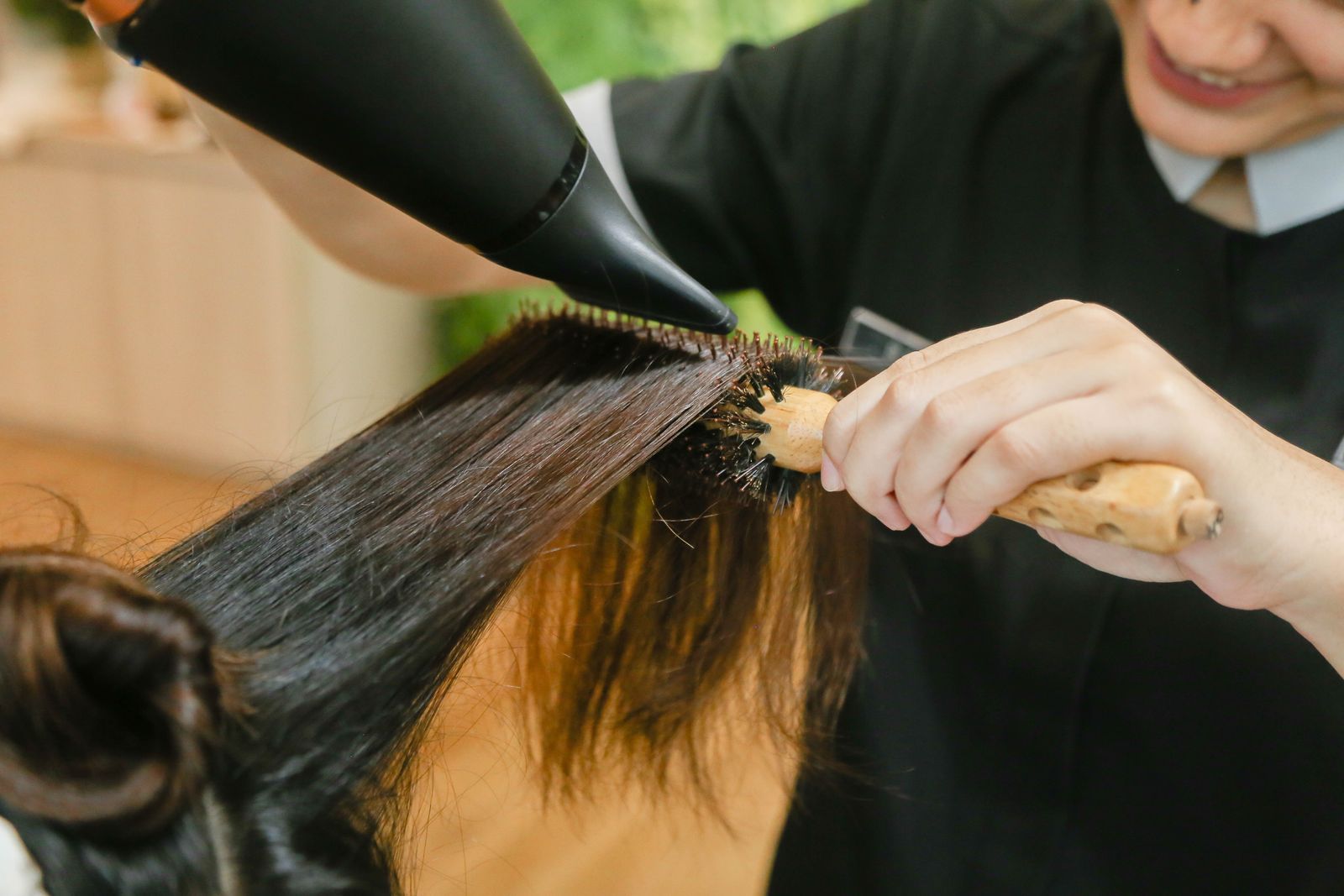 Round-brush blow-dry finishing a style